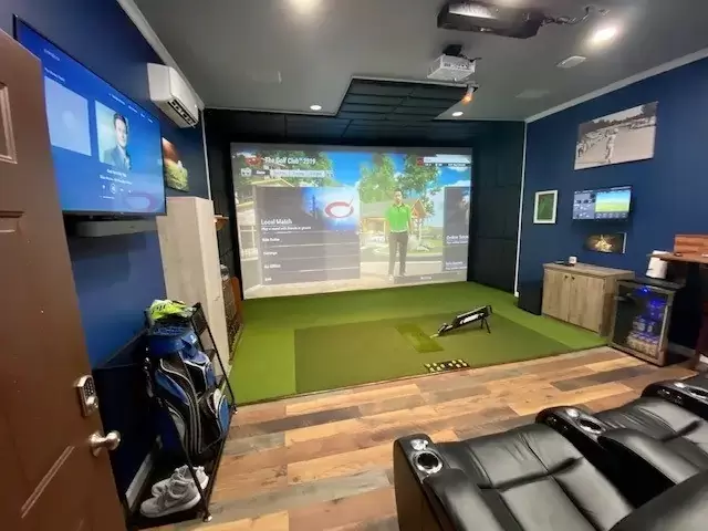 Basement golf simulator man cave