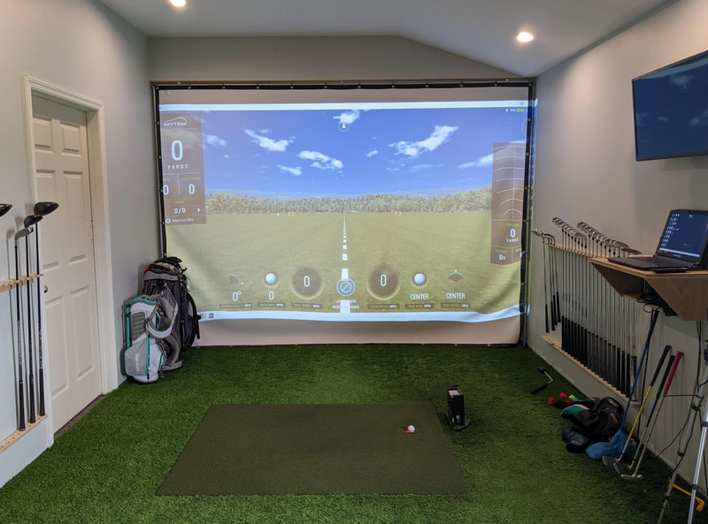 man cave with a golf simulator