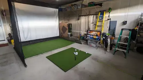 golf simulator in a garage